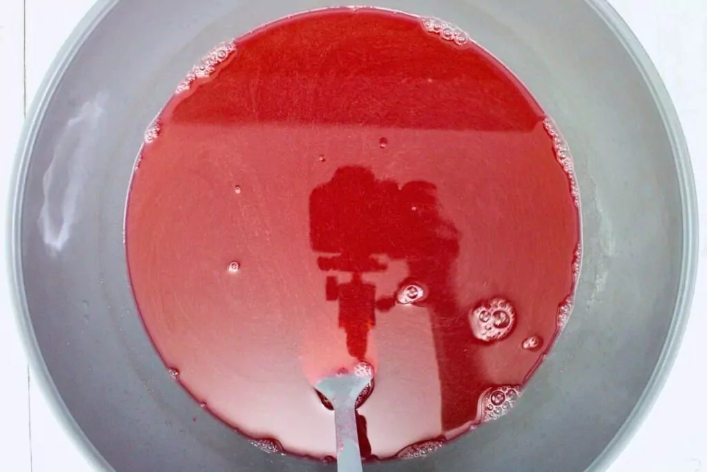 pour hot watermelon jello mixture into the cold mixture