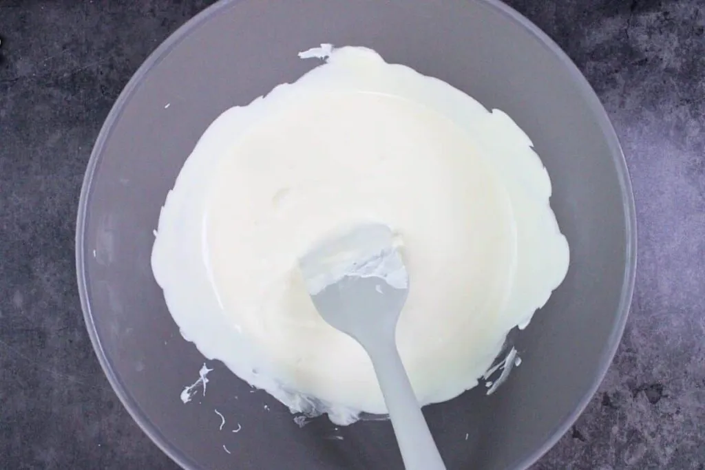 melt white chocolate for top of ghost rice krispie treats